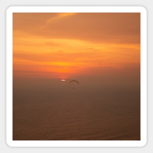 Bright golden sunset over the sea with one paraglider Magnet